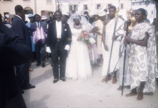 Christian wedding in Ghana. A Ghanaian bride arrives for her wedding accompanied by her father who