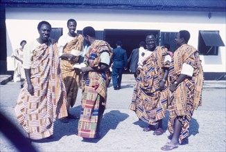 Ghanaian men wearing kente cloth. A group of Ghanaian men wear traditional kente cloth at a