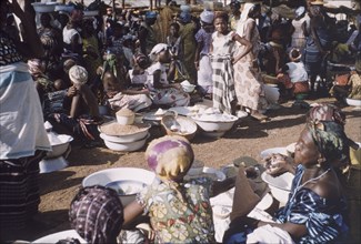 Market in Tamale, Ghana. Women sell rice and other foodstuffs at an outdoor market in Tamale.