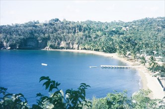 A fishing bay in St Lucia. View over a bay at St Lucia, where fishing boats are moored on the beach
