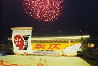 Fireworks for the handover of Hong Kong. Fireworks explode over Beijing stadium during celebrations