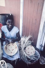 Weaving baskets, Jamaica. An official publicity shot for the Jamaican Tourist Board features a