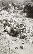 Panning for gold at Kakamega. African labourers pan for gold in the dried-up Wacheche River,