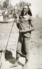 Kenyan man in traditional dress. Full-length portrait of a Kenyan man in traditional dress, adorned
