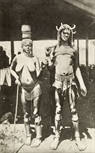 Portrait of a Kavirondo couple. Full-length portrait of a semi-naked Kavirondo (Luo) couple.