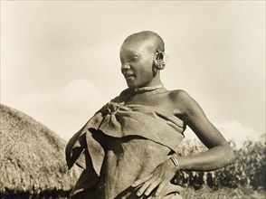 A married Kikuyu woman. Portrait of a married Kikuyu woman, dressed in a wrap-around cloth tied at