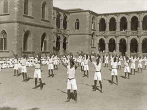Exercises at Gordon College. African students exercise in an outdoor courtyard during an inspection