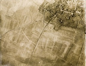 Aerial view of a bomb-damaged village. One of a series of British aerial reconnaissance photographs