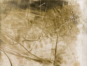 Aerial view of a bomb-damaged village. One of a series of British aerial reconnaissance photographs