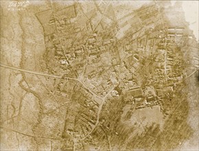 Aerial view of a bomb-damaged village. One of a series of British aerial reconnaissance photographs