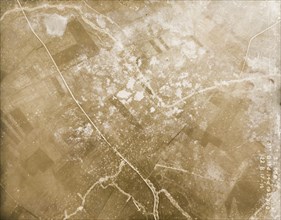 Fields riddled with trenches and bomb craters. One of a series of British aerial reconnaissance