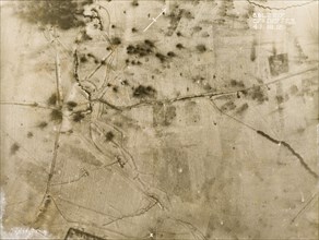 Shell blasts in the snow. One of a series of British aerial reconnaissance photographs recording