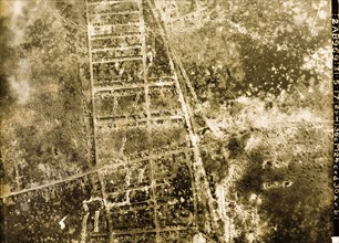 Aerial view of a bomb-damaged town. One of a series of British aerial reconnaissance photographs