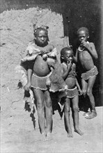 Three African boys. Three young boys, possibly members of a Bantu-speaking tribe, pose for the