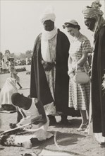 Queen Elizabeth II visits Kaduna Children's Village. Queen Elizabeth II is accompanied by the
