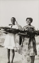 Nigerian gifts for Queen Elizabeth II. Two adolescents from Kaduna Children's Village prepare to