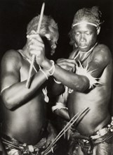 Two Nigerian dancers. Night portrait of two male Nigerian dancers. Naked from the waist up, one man