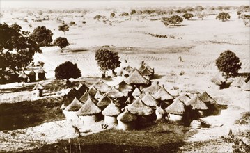 A Gwari village. A Gwari (Gbagi) settlement on the open plains, containing a cluster of round huts