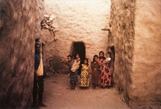 A group of children in Yemen. A group of children pose for the camera in an alcove formed by