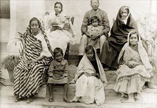 Portrait of an Indian family. Group portrait of an Indian family wearing traditional dress. Four