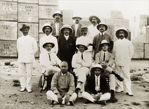 Civil engineers at the Hong Kong docks. A team of British and Chinese civil engineers pose for a