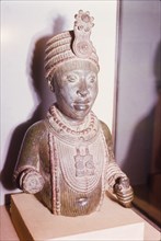 Yoruba bronze sculpture. A bronze sculpture of a head and upper torso, possibly a royal or