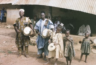 Musicians at Oyo. A group of adult and child musicians, originally captioned as 'palace drummers',