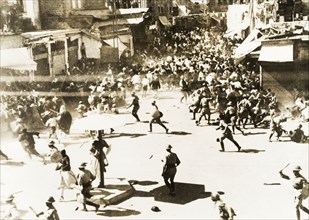 Riots in Jaffa, 1936. Rioting crowds of Palestinian Arabs disperse in chaos as British military