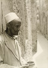 Profile shot of a Muslim man. Profile shot of a Muslim man wearing an embroidered kufi (cap). He