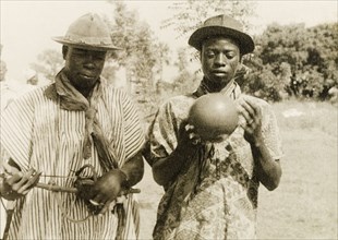 The chief's musicians'. Two men, described in an original caption as "the chief's musicians", play