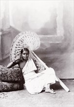 Studio portrait of a Ceylonian woman. Seated studio portrait of a Ceylonian woman in traditional