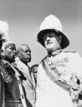 Sir Phillip Mitchell greets African chiefs. Sir Phillip Mitchell (1890-1964), the Governor of