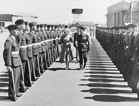 Princess Elizabeth inspects a Guard of Honour. Princess Elizabeth is accompanied by a British