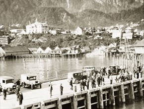 Juneau Pier, Alaska. Visitors enjoy the view of the Gastineau Channel from the wooden pier at the