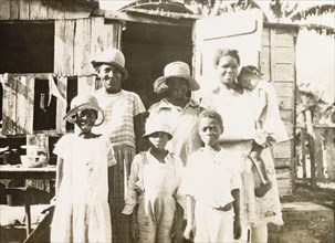 Tobagoan women and children. Three Tobagoan women and their children pose for a group portrait on a
