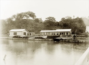 San Fernando railway station, Trinidad. View across a river to a steam locomotive pulled in at San
