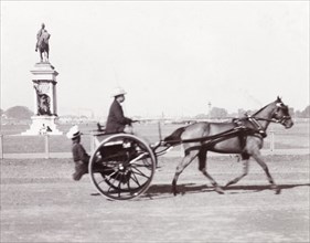 Driving a tonga, India. James Murray drives a horse-drawn tonga along a track in Calcutta. Calcutta