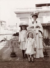 An Edwardian family. Portrait of Minnie Murray, elegantly dressed in Edwardian-style, posing with