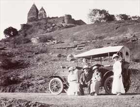 Road trip, India. James and Minnie Murray pose beside their parked motor car with two friends near