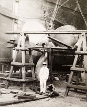 Kidderpore dock, Calcutta. James Murray stands beneath a scaffold, which supports the giant