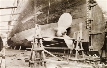 Ship at Kidderpore dry dock. View of a large ship dry-docked at Kidderpore dock, supported by a