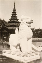 Lion statue at Shwe Dagon Pagoda. A statue of a lion outside a temple at the Shwe Dagon Pagoda.