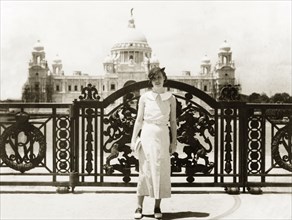 Posing outside Victoria Memorial Hall. A European woman poses in front of the ornate gateway to