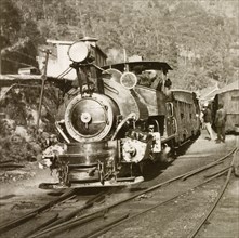 Steam train on the Darjeeling Railway. A steam locomotive travels along the narrow-gauge tracks of