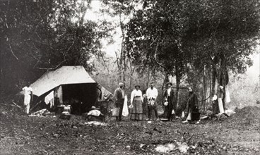 Hunting party camp, Ceylon. A group of Europeans attending an elephant kraal or drive pose at their