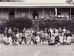 Wedding party, St Helena. A newly-wed couple pose for a portrait with a large group of family and