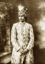 Portrait of a Maharajah. Studio portrait of an unidentified Maharajah dressed in ceremonial attire.