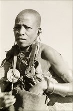 Kikuyu woman wearing traditional jewellery. Portrait of a Kikuyu woman wearing traditional