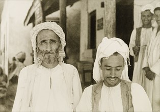 Portrait of two Arab men. Portrait of two Arab men, one young and one elderly, wearing traditional