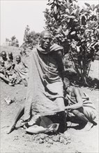 Kikuyu purification ceremony. A Kikuyu witch doctor performs a traditional purification ceremony to